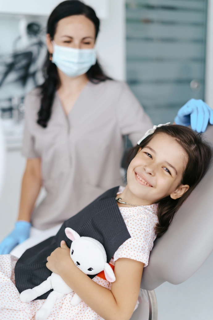 little-beautiful-girl-dentist-looking-smiling